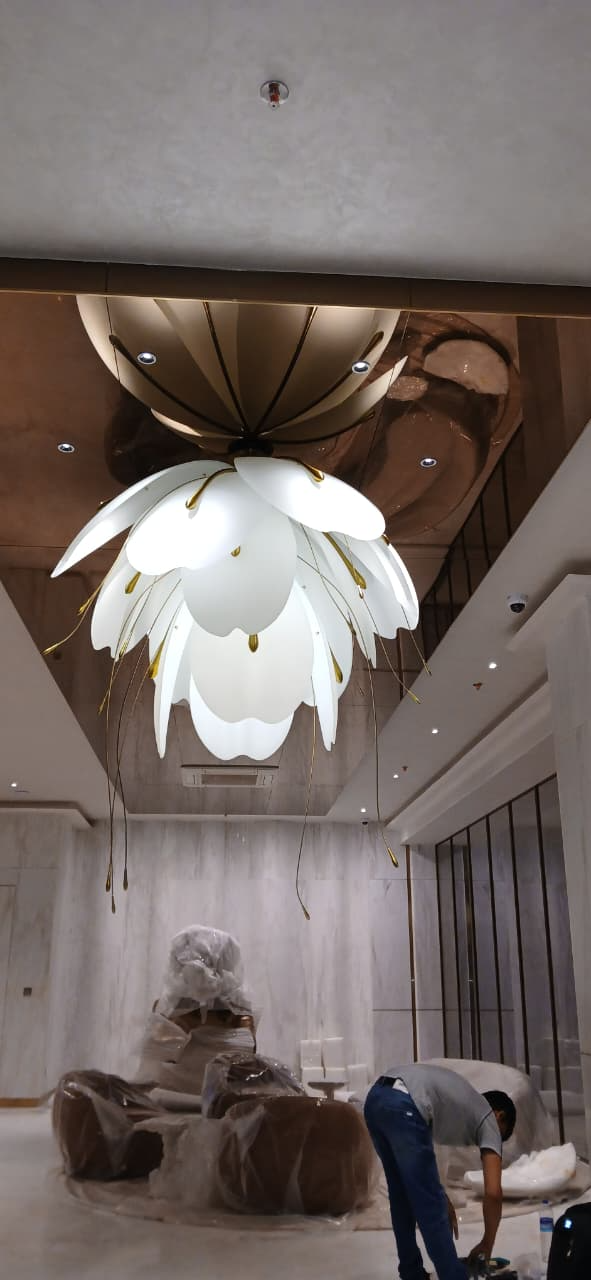 Large imported Italian floral chandelier installed by experienced luxury lighting professionals in India.